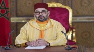 A picture released by the Moroccan Royal Palace shows Morocco's King Mohammed VI addressing speech, transmitted via a screen to the parliament, from the Royal Palace in the northeastern city of Fez, on October 8, 2021. - Mohammed VI named a new government led by Aziz Akhannouch, a billionaire tycoon close to the palace who will face pressing economic problems exacerbated by the coronavirus pandemic. The 24-member cabinet, formed after Akhannouch's National Rally of Independents (RNI) trounced incumbent Islamists in elections last month, includes seven women, up from four in the previous administration. (Photo by Moroccan Royal Palace / AFP) / RESTRICTED TO EDITORIAL USE - MANDATORY CREDIT "AFP PHOTO / SOURCE / MOROCCAN ROYAL PALACE- NO MARKETING NO ADVERTISING CAMPAIGNS - DISTRIBUTED AS A SERVICE TO CLIENTS