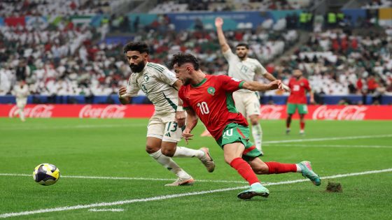 Soccer Football - FIFA Arab Cup - Qatar 2025 - Group B - Morocco v Saudi Arabia - Lusail Stadium, Lusail, Qatar - December 8, 2025 Morocco's Amine Zouhzouh in action with Saudi Arabia's Nawaf Boushal REUTERS/Mohammed Salem