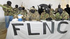 (FILES) -- A file photo taken in October 2006 shows members of a commando claiming to belong to the National Liberation Front of Corsica (FLNC), meeting with the press at an undisclosed location in Corsica. Corsica's main militant group FLNC, which has staged attacks since the 1970s in its quest for the island's separation from France, said on June 25, 2014 it would lay down arms. The National Liberation Front of Corsica said in a statement that it has "unilaterally decided to begin a process of demilitarisation... without any pre-conditions". AFP PHOTO STEPHAN AGOSTINI